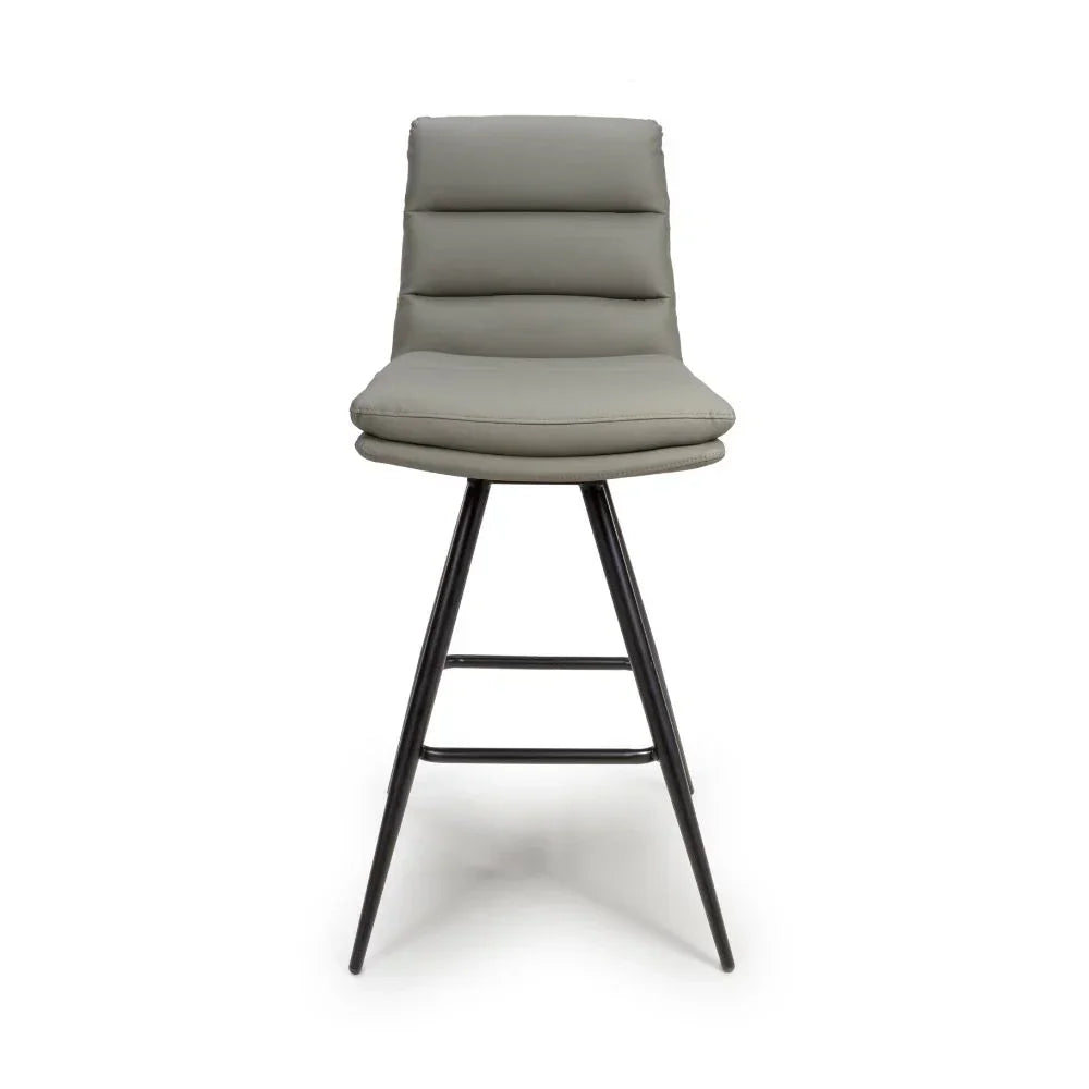 Grey bar stool with padded seat, metal legs, and horizontal stitched backrest, front view