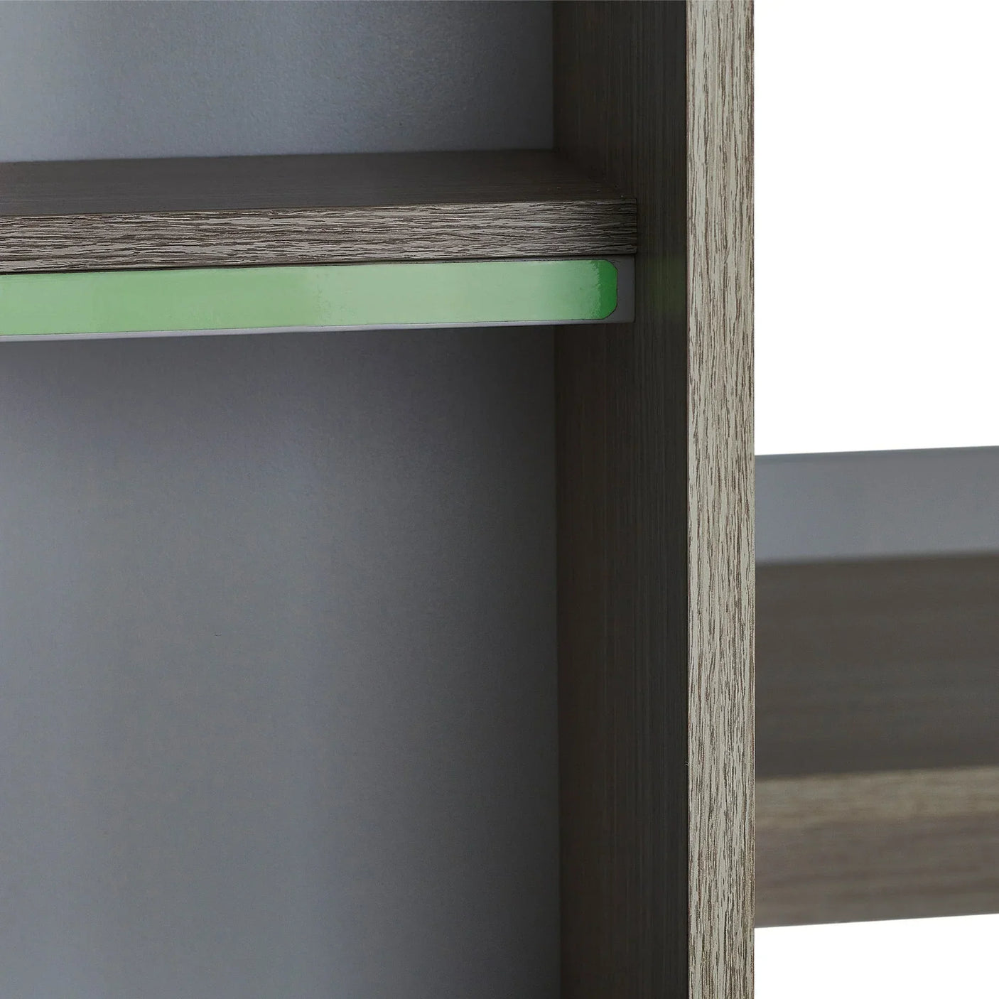 Close-up of Ocean Highsleeper pale wood shelving with green accent panel detail
