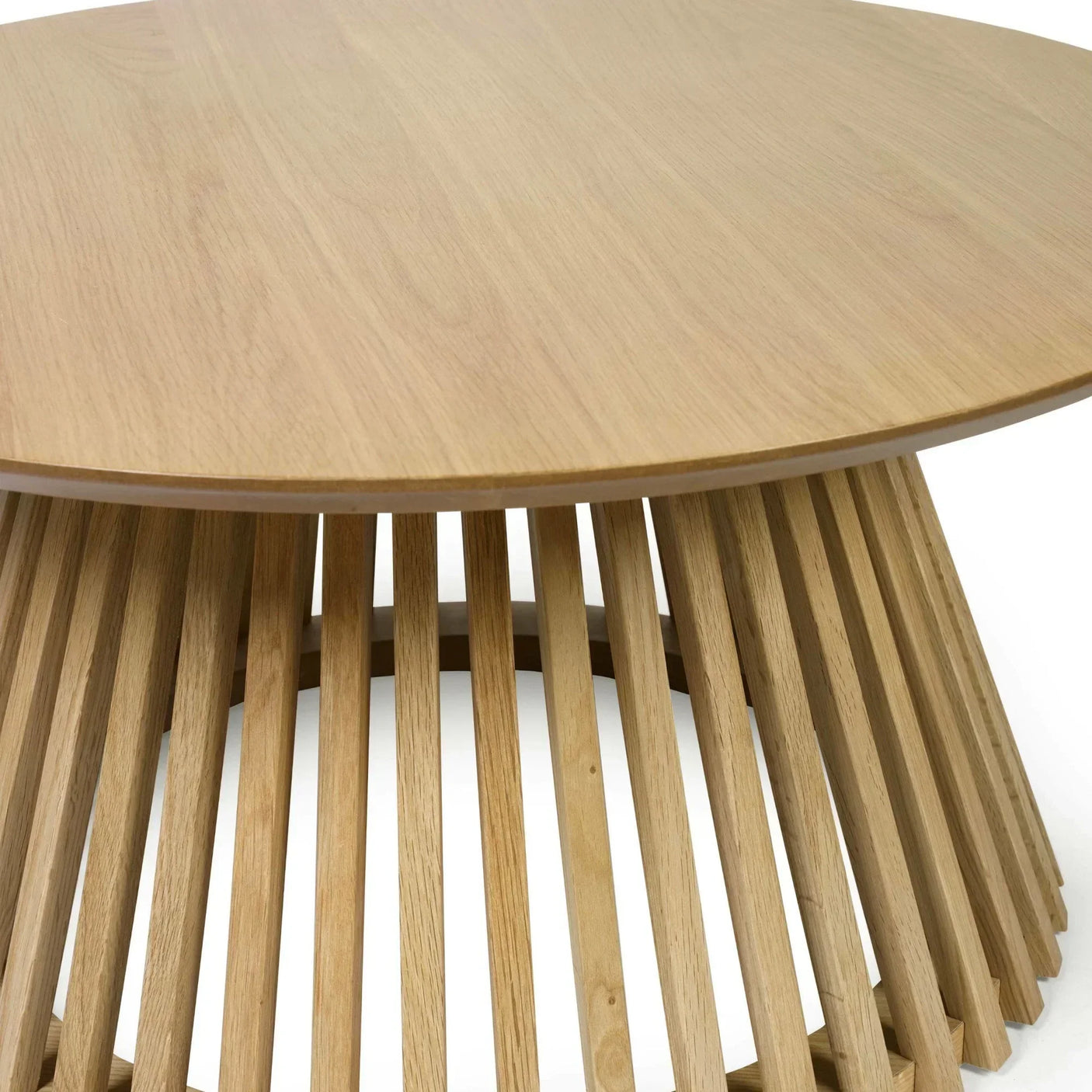 Round oak coffee table with slatted wooden base, close view of tabletop and legs