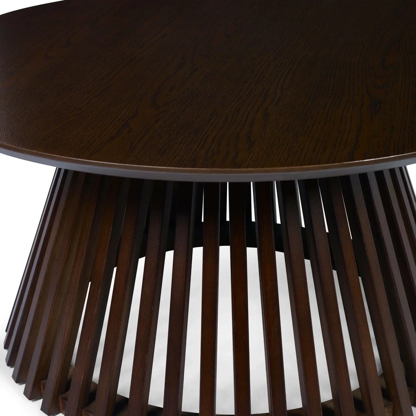 Dark wood coffee table with round top and slatted geometric base