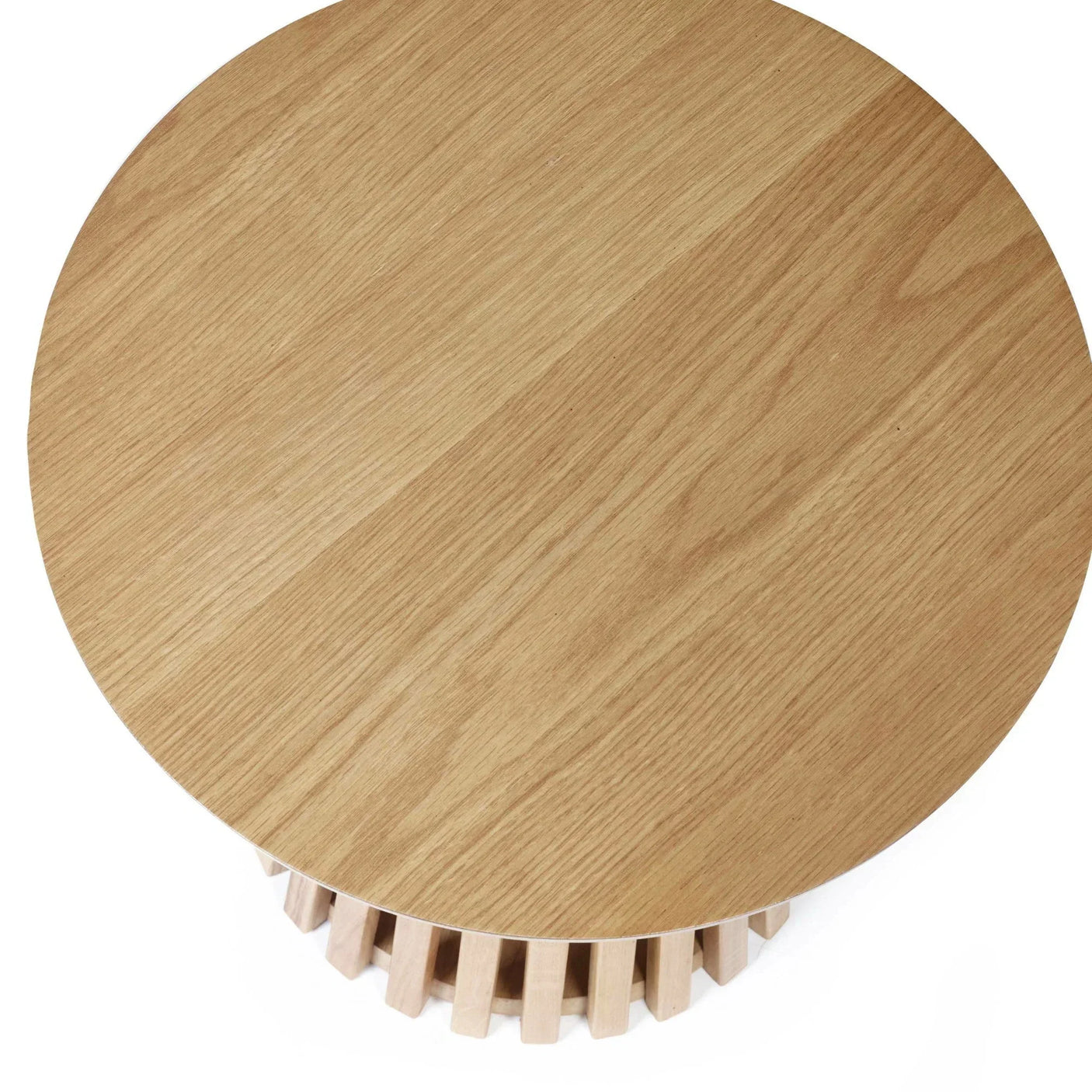 Round oak coffee table top with slatted wooden base, top-down view