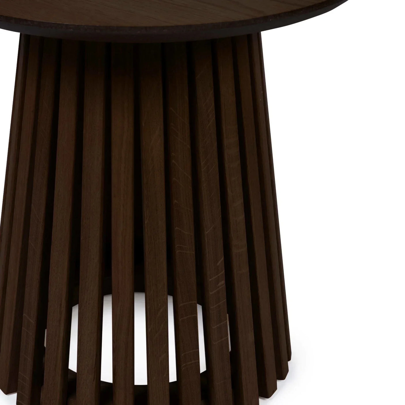 Round walnut wood side table with slatted base and smooth finish, close-up view