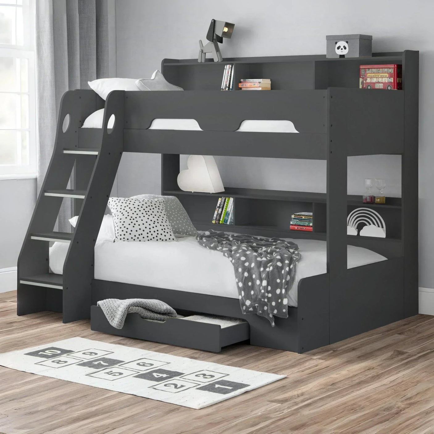 Grey bunk bed with built-in ladder, shelving, underbed drawer and polka dot bedding