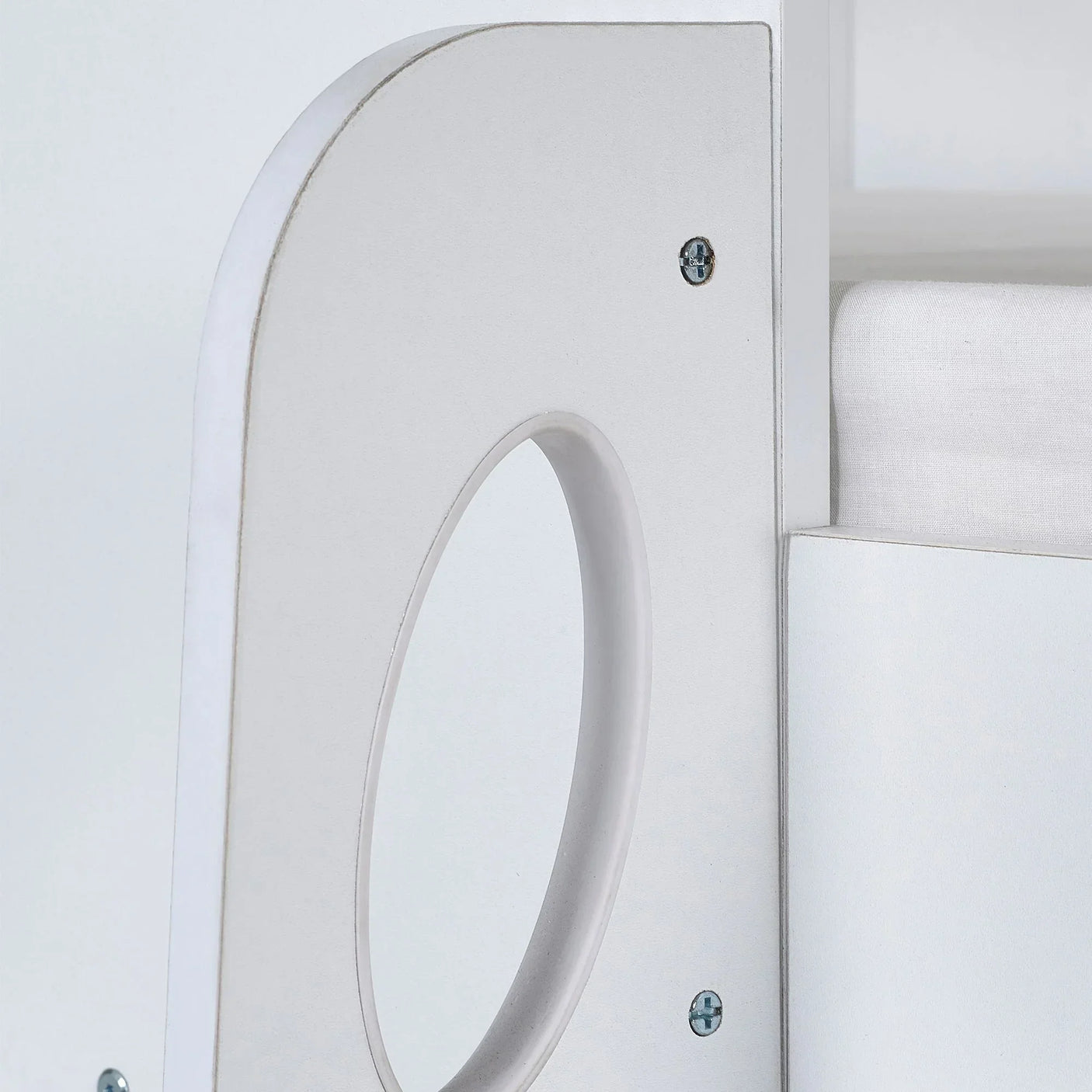 Orpheus midsleeper bed close-up showing pale wood frame with circular cutout detail
