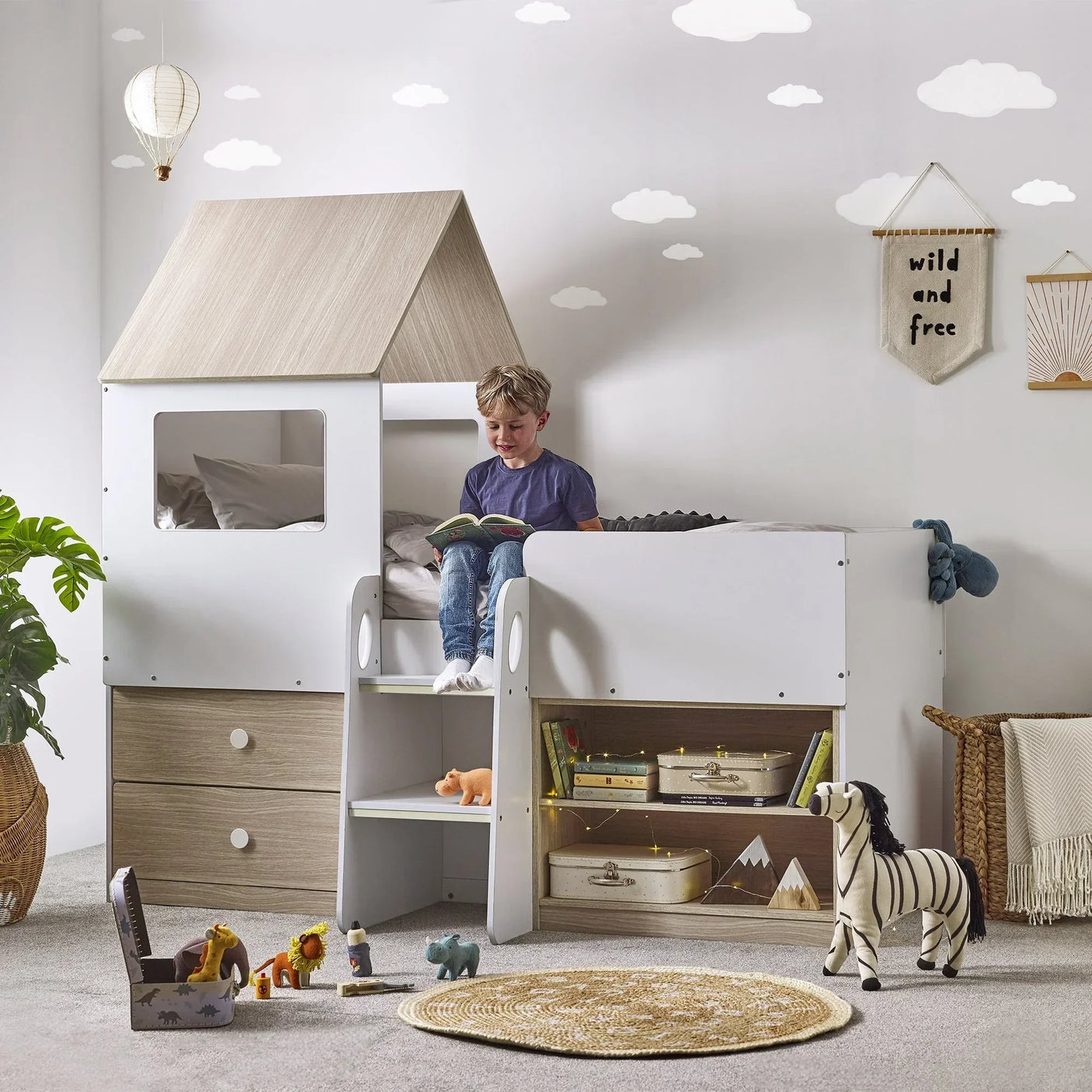 Orpheus midsleeper bed in pale wood and white with steps, drawers, and storage in kids room