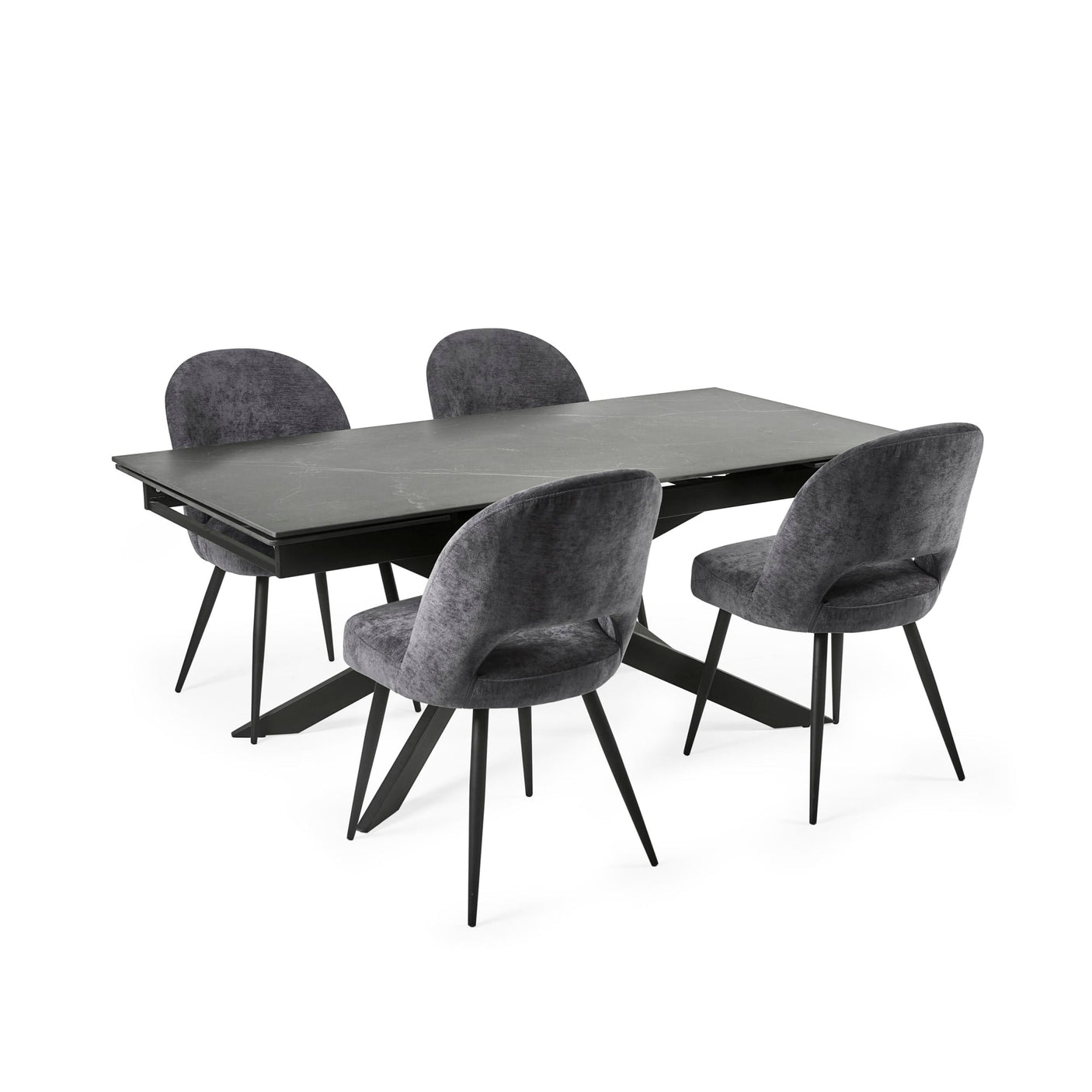 Extended black dining table with six grey velvet chairs arranged neatly on white background.