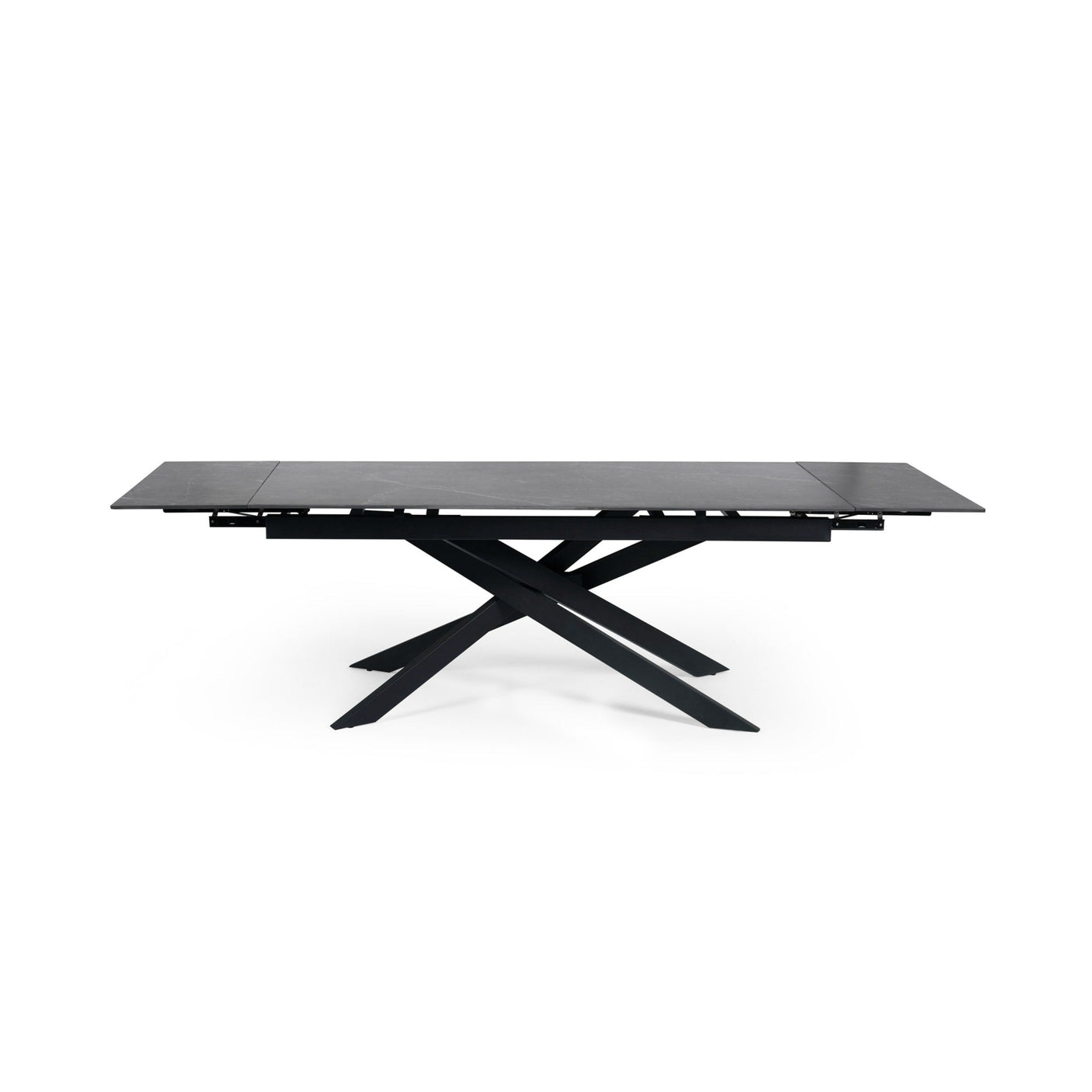 Extended rectangular dining table with black marble top and black metal crossed legs, front view isolated on white