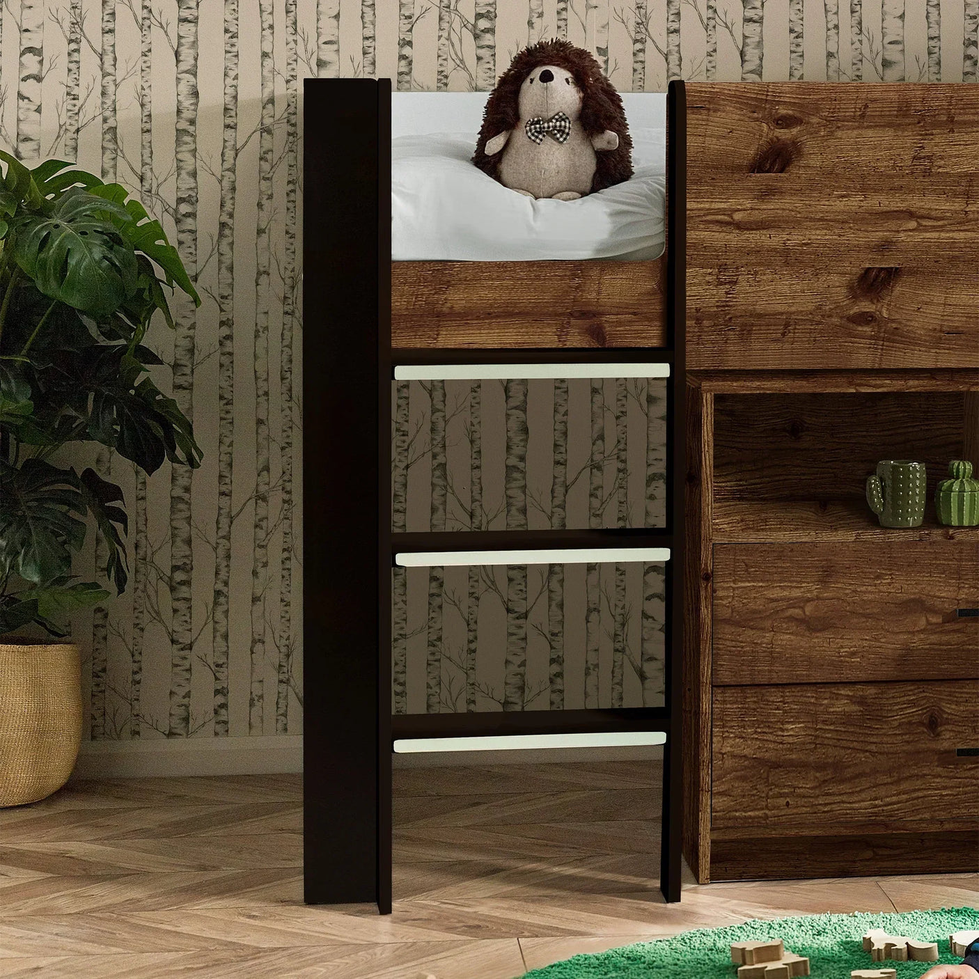 Urban rustic midsleeper bed with black ladder, open shelving and plush toy on top bunk