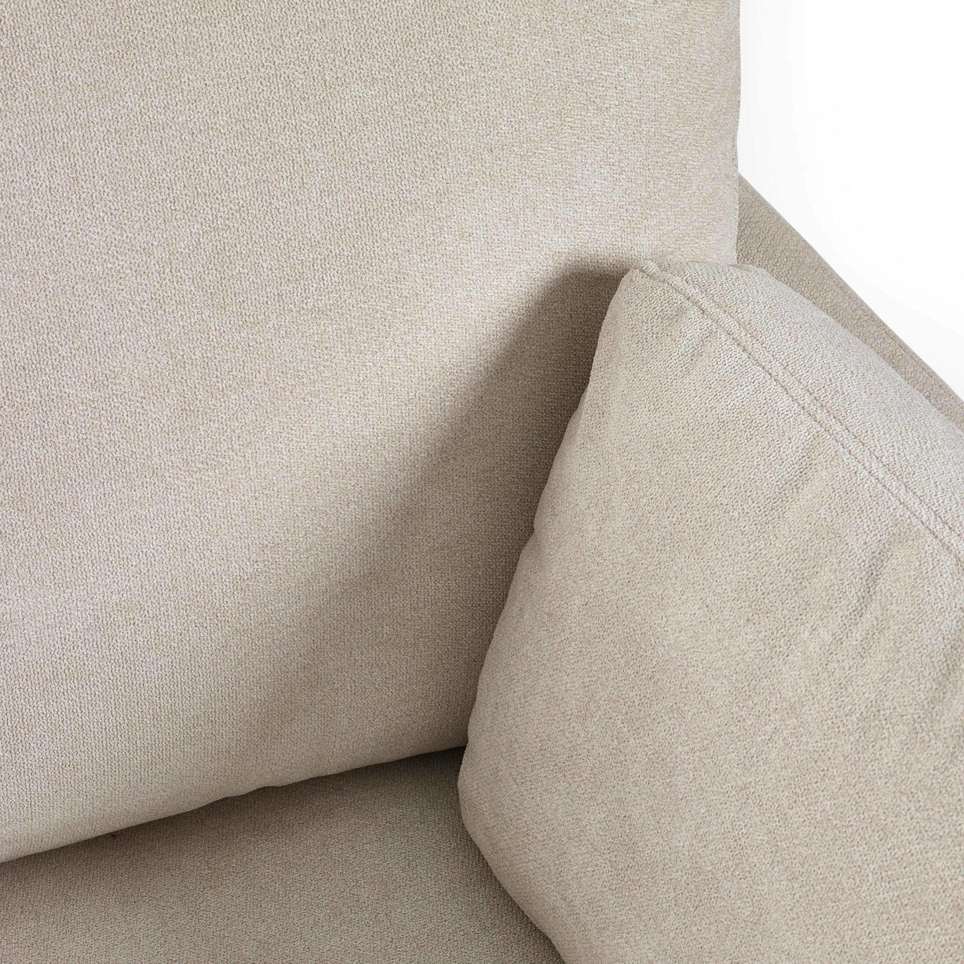 Close up of beige fabric sofa cushion and backrest texture