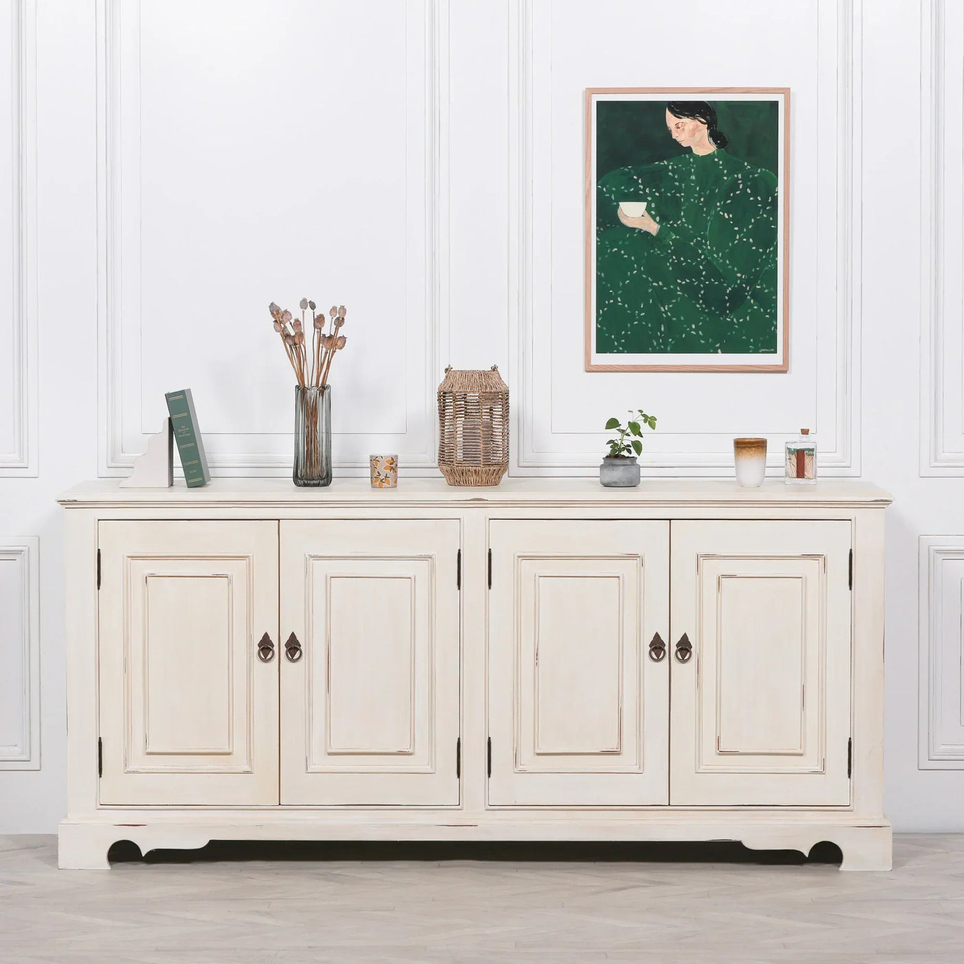 Cream sideboard with four paneled doors, styled with decor and wall art in a modern room