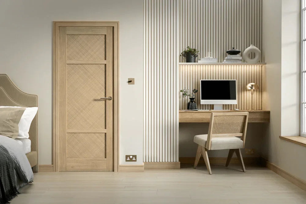 Oak internal door beside modern home office desk with oak chair and computer monitor