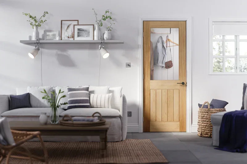 Oak Belize glazed internal door with clear glass panel in bright modern living room