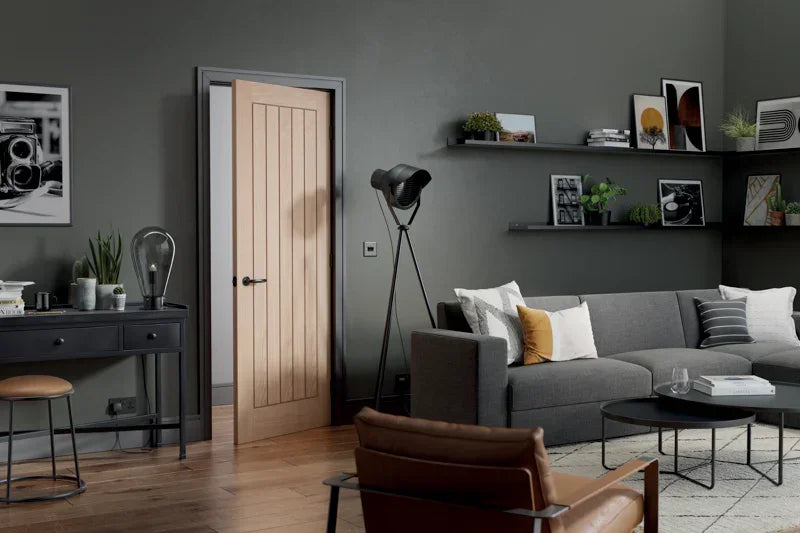 Oak Belize pre-finished internal door with vertical panels in modern living room setting
