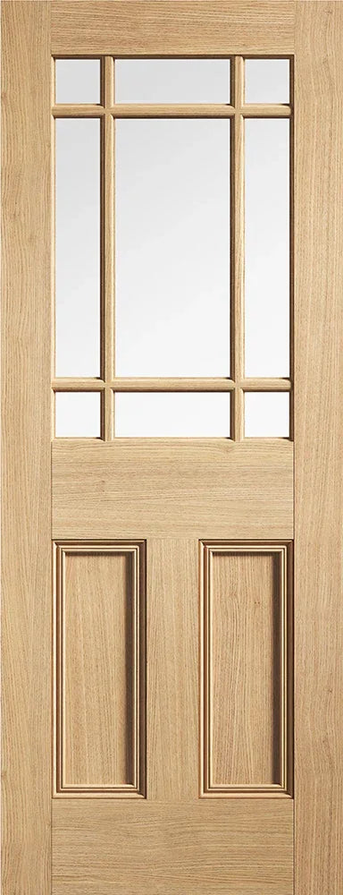 Oak glazed internal door with nine clear glass panels and raised wood panels, front view