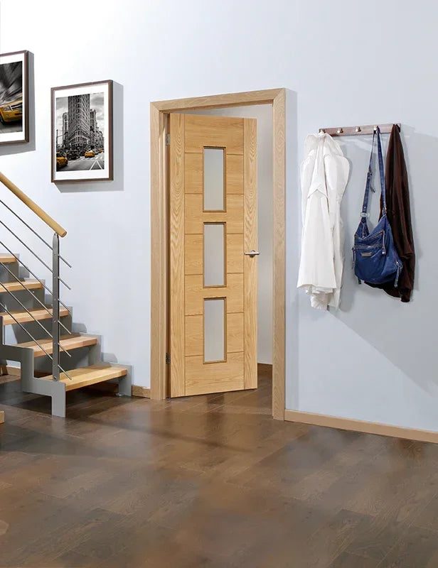 Oak Hampshire glazed internal door with three glass panels in modern hallway setting