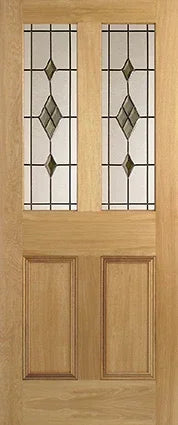 Oak internal door with two decorative glazed panels and raised lower panels