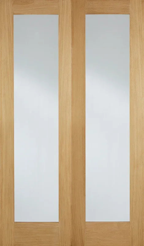 Oak glazed door pair with clear vertical glass panels