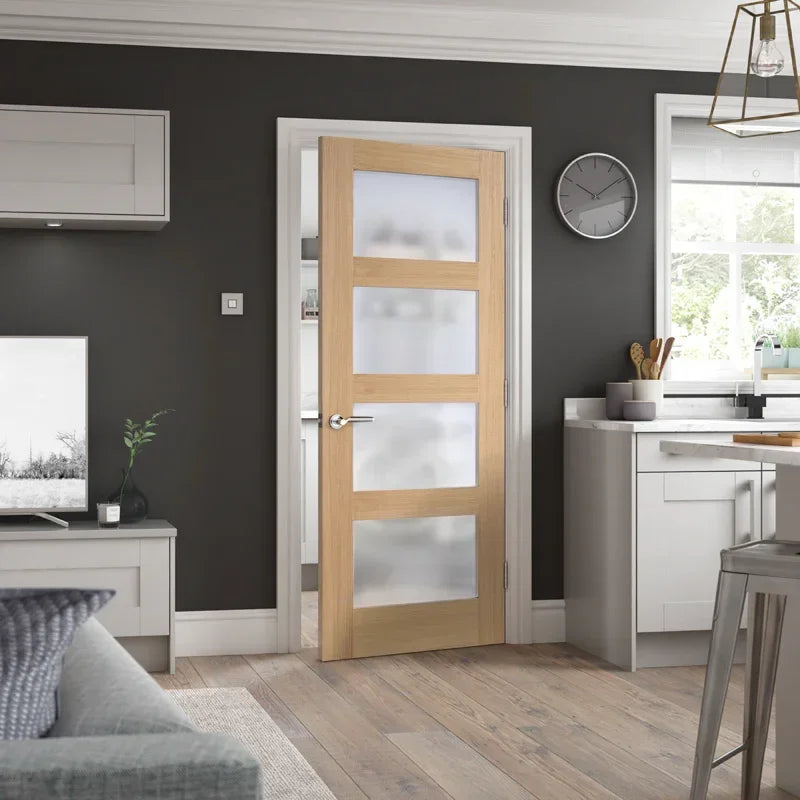 Oak shaker glazed door with four frosted glass panels in modern kitchen living area