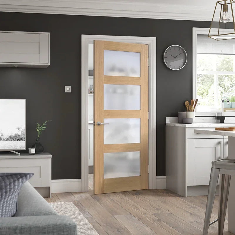 Oak shaker glazed door with four frosted glass panels installed in a modern kitchen