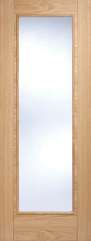 Oak glazed internal door with vertical glass panel and light wood grain finish