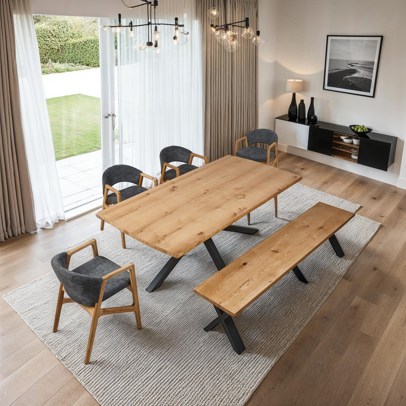 Onyx 2 metre dining table with black legs, matching bench, and four wooden dining chairs