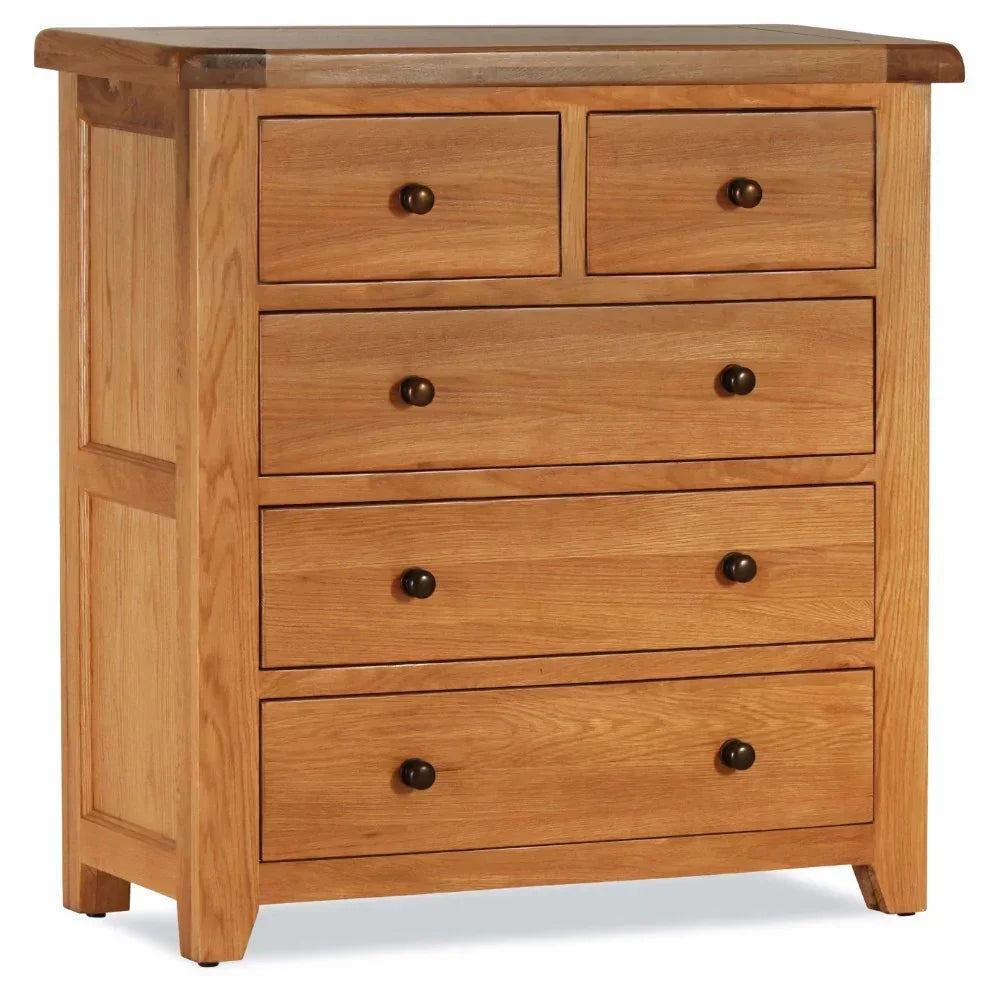Oak chest of drawers with five drawers and metal knobs, shown from a front angle