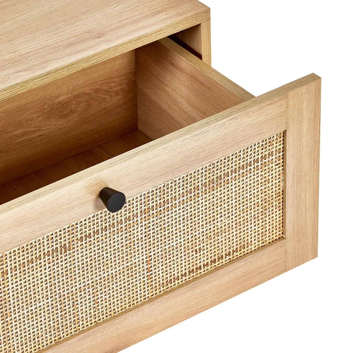 Wooden drawer with rattan front panel and black handle, shown partially open
