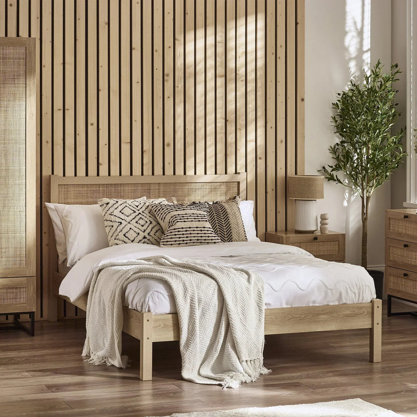 Padstow oak rattan double bed with white bedding in modern bedroom with wood accents