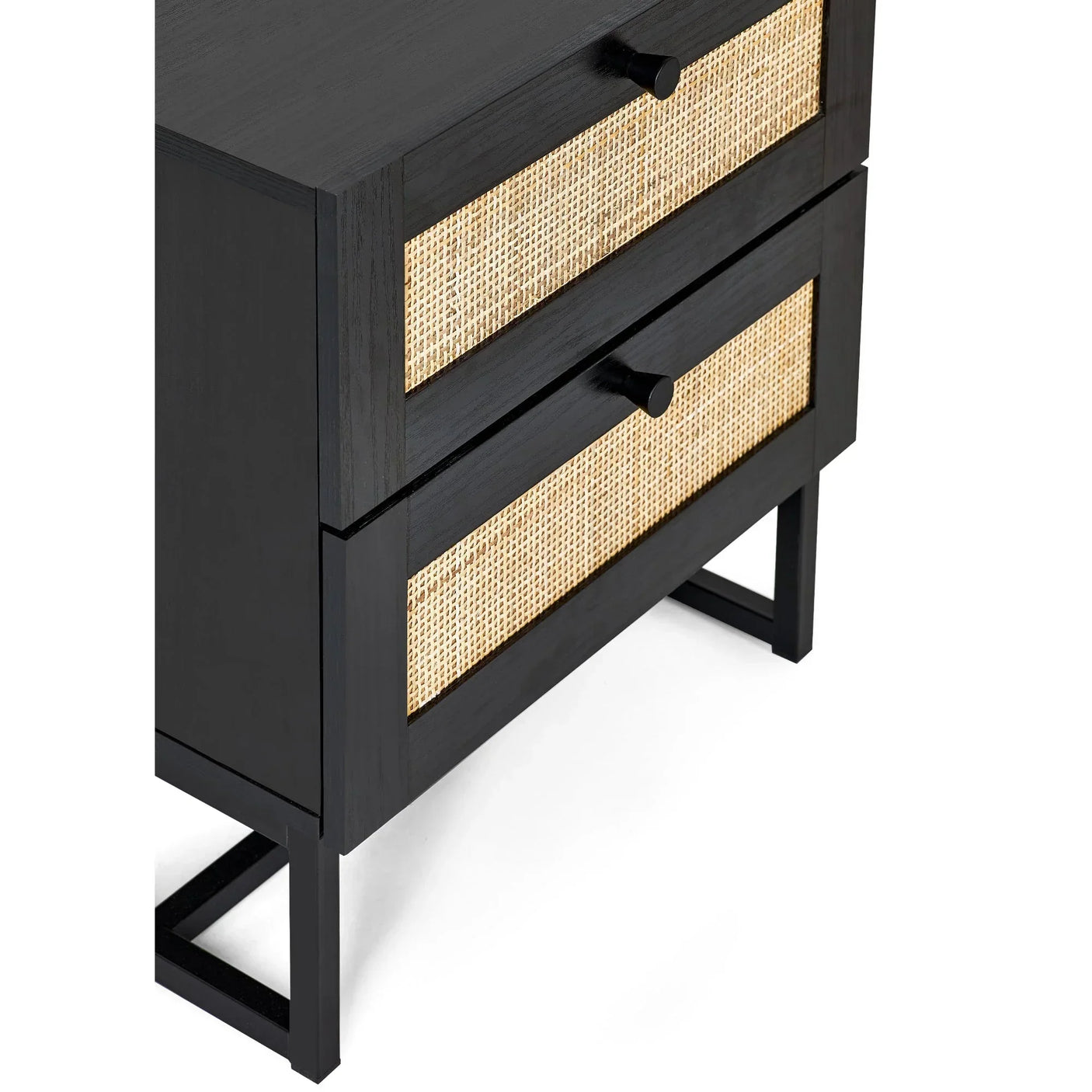 Black two drawer bedside table with rattan fronts and metal legs, close-up angle