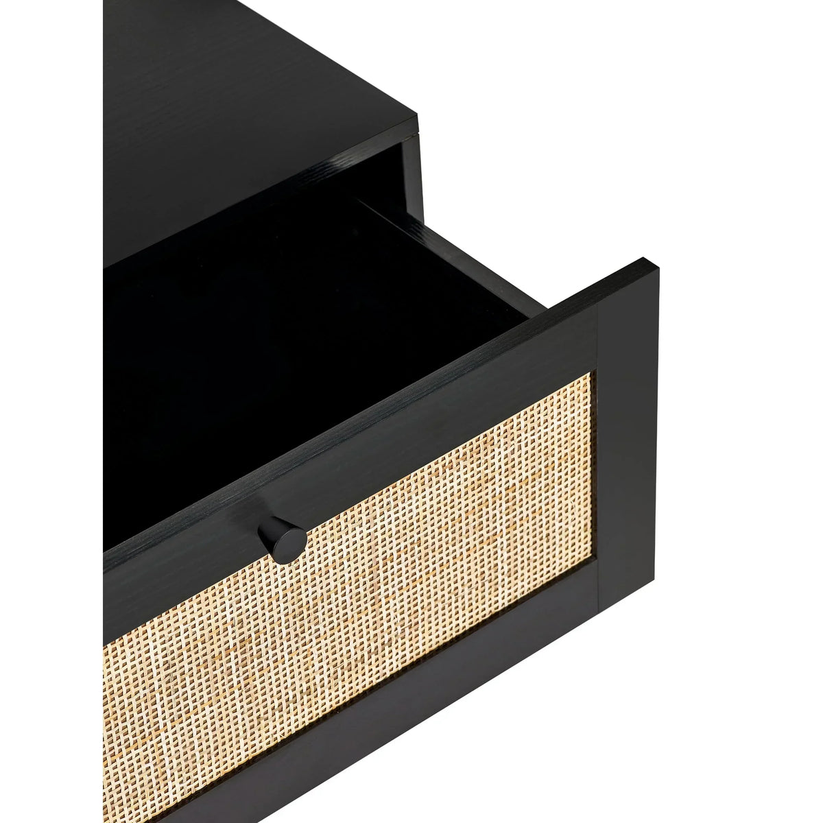 Black bedside table with open drawer and rattan front detail, wood texture visible