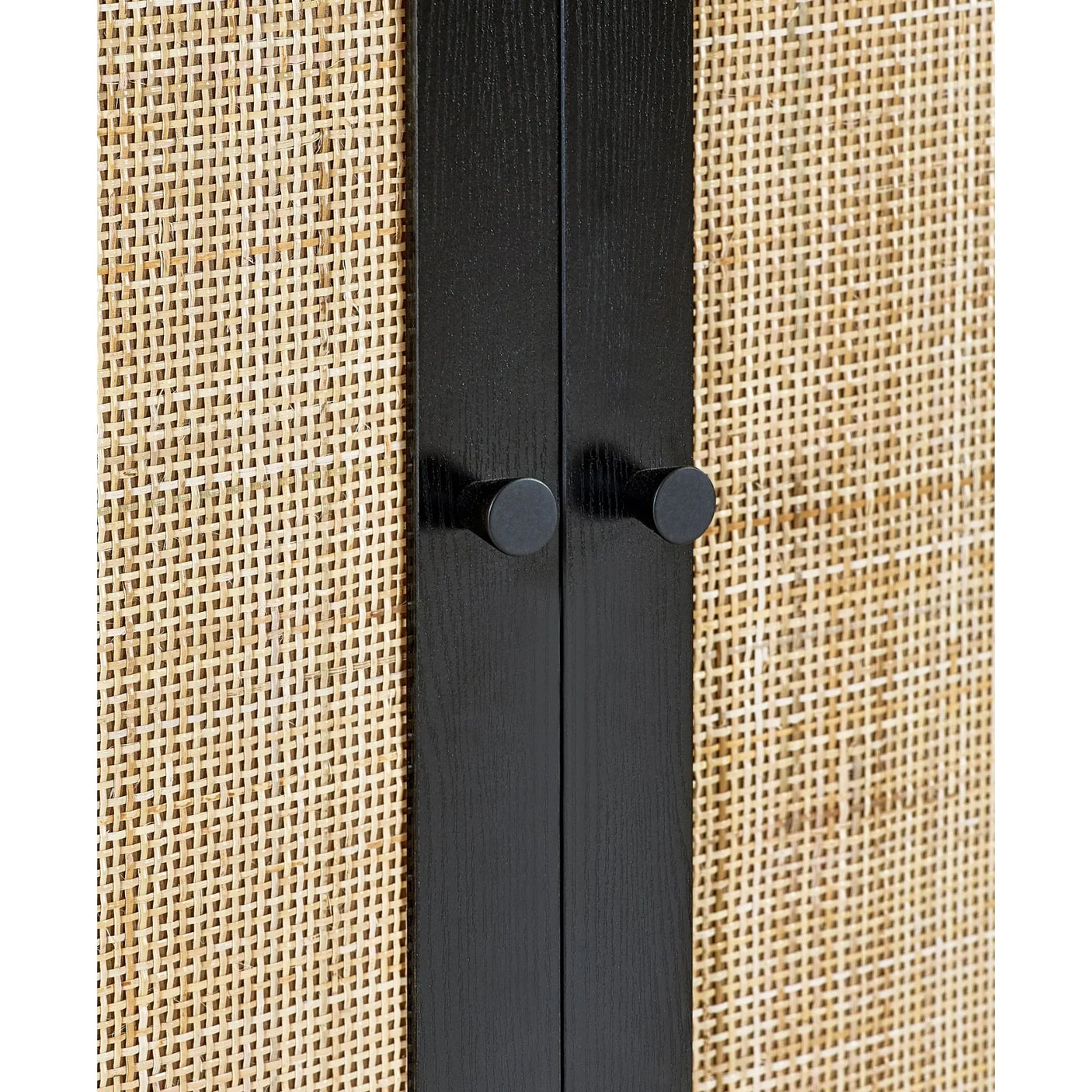 Black wardrobe with rattan doors closeup showing wood handles and woven panel detail