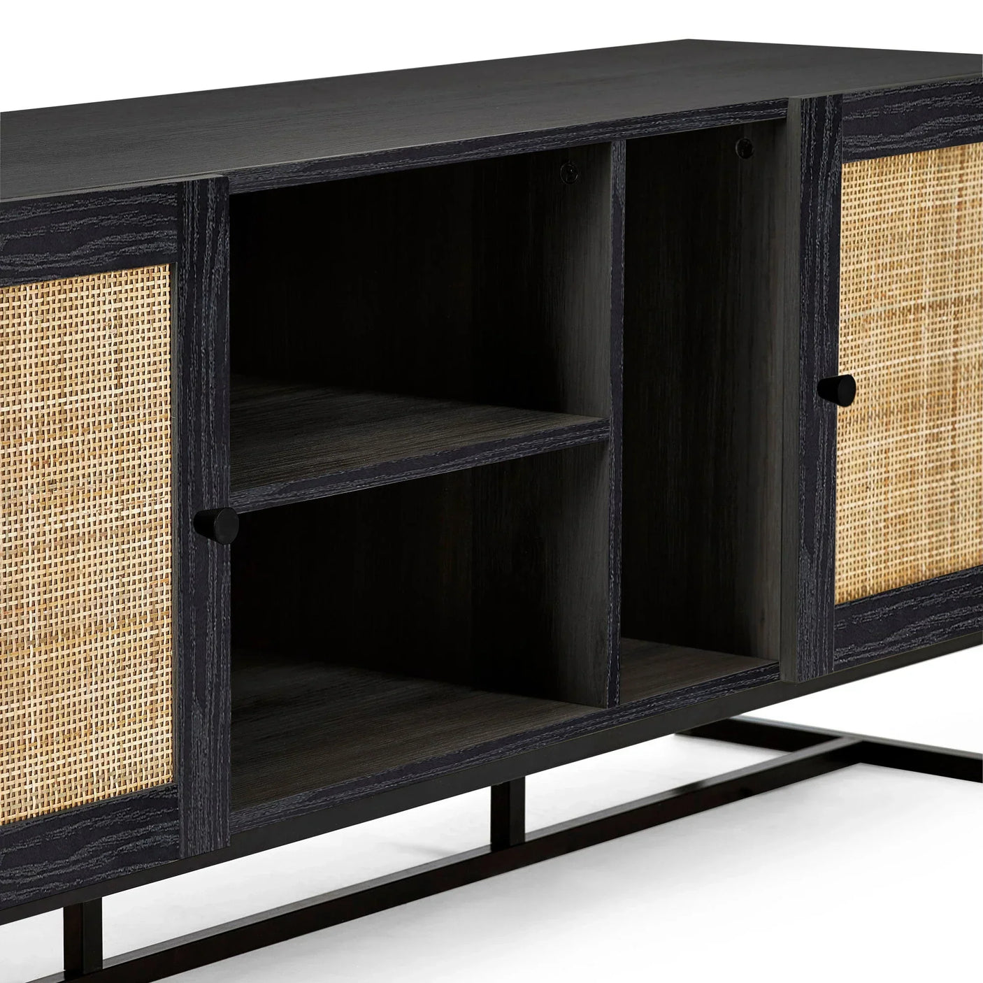Black wood sideboard with rattan doors and open shelf compartments, close-up view