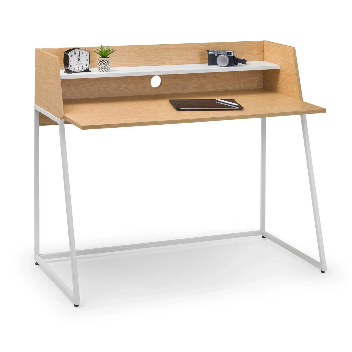 Oak effect writing desk with white metal legs and raised shelf, styled with decor items