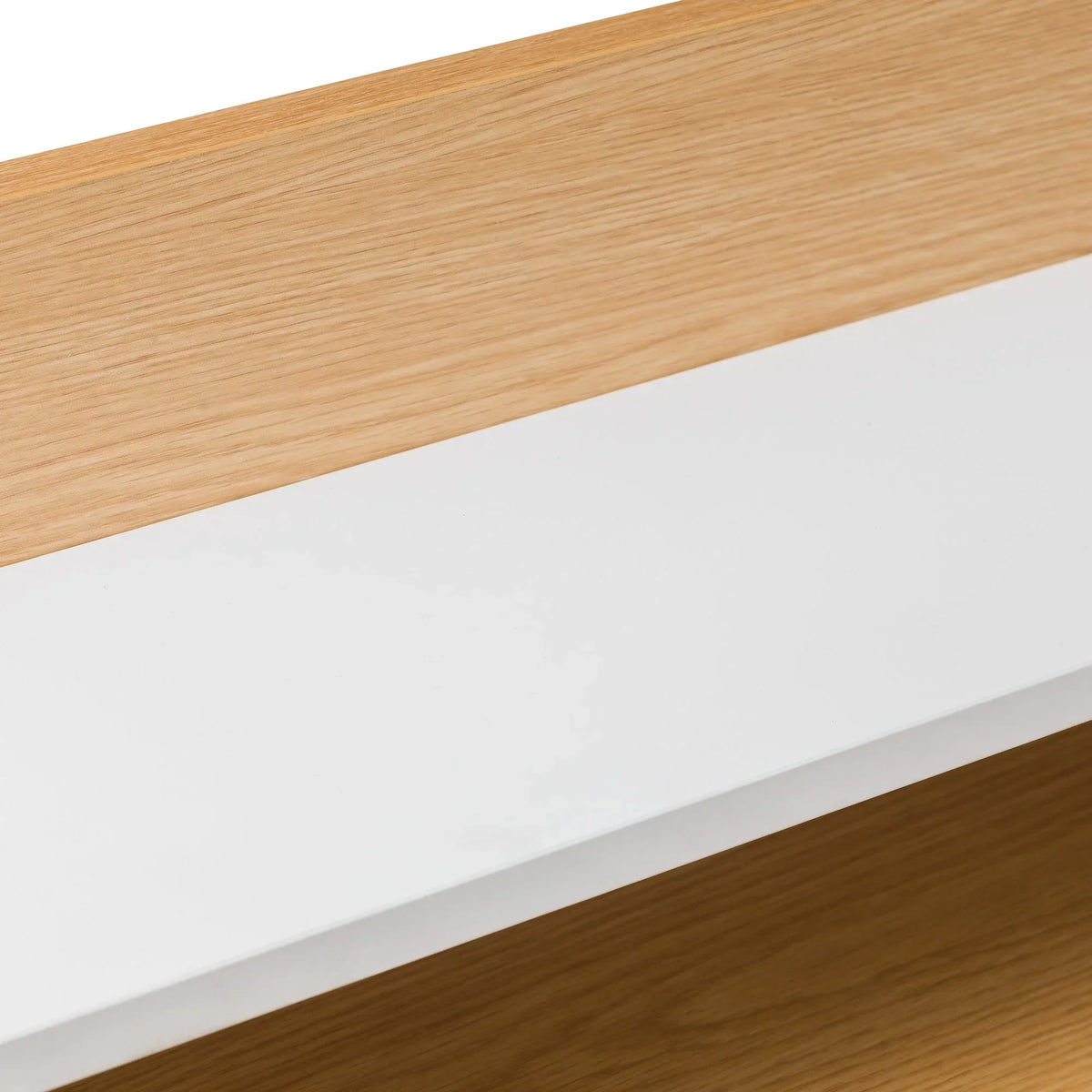 Detail of wooden furniture with white panel and natural oak finish