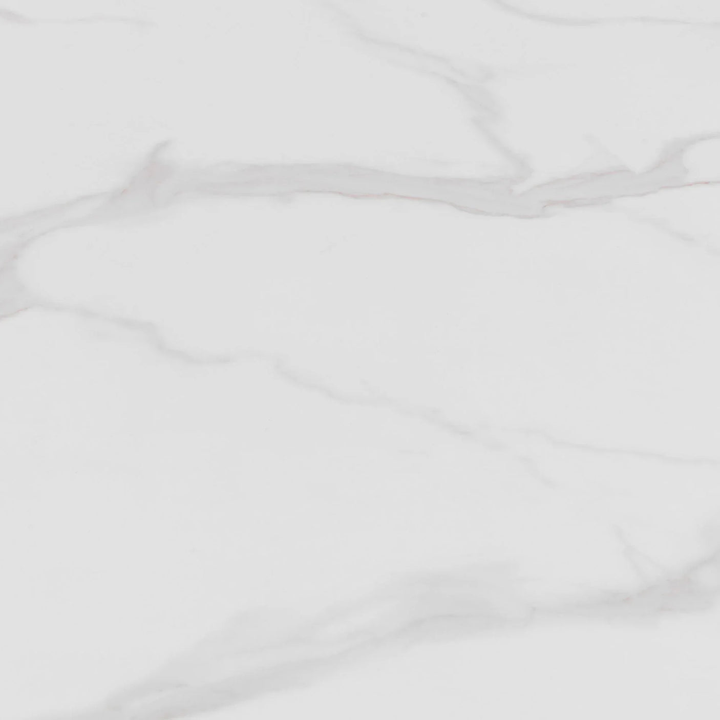 White marble table top with light grey veining pattern, close-up view of surface texture