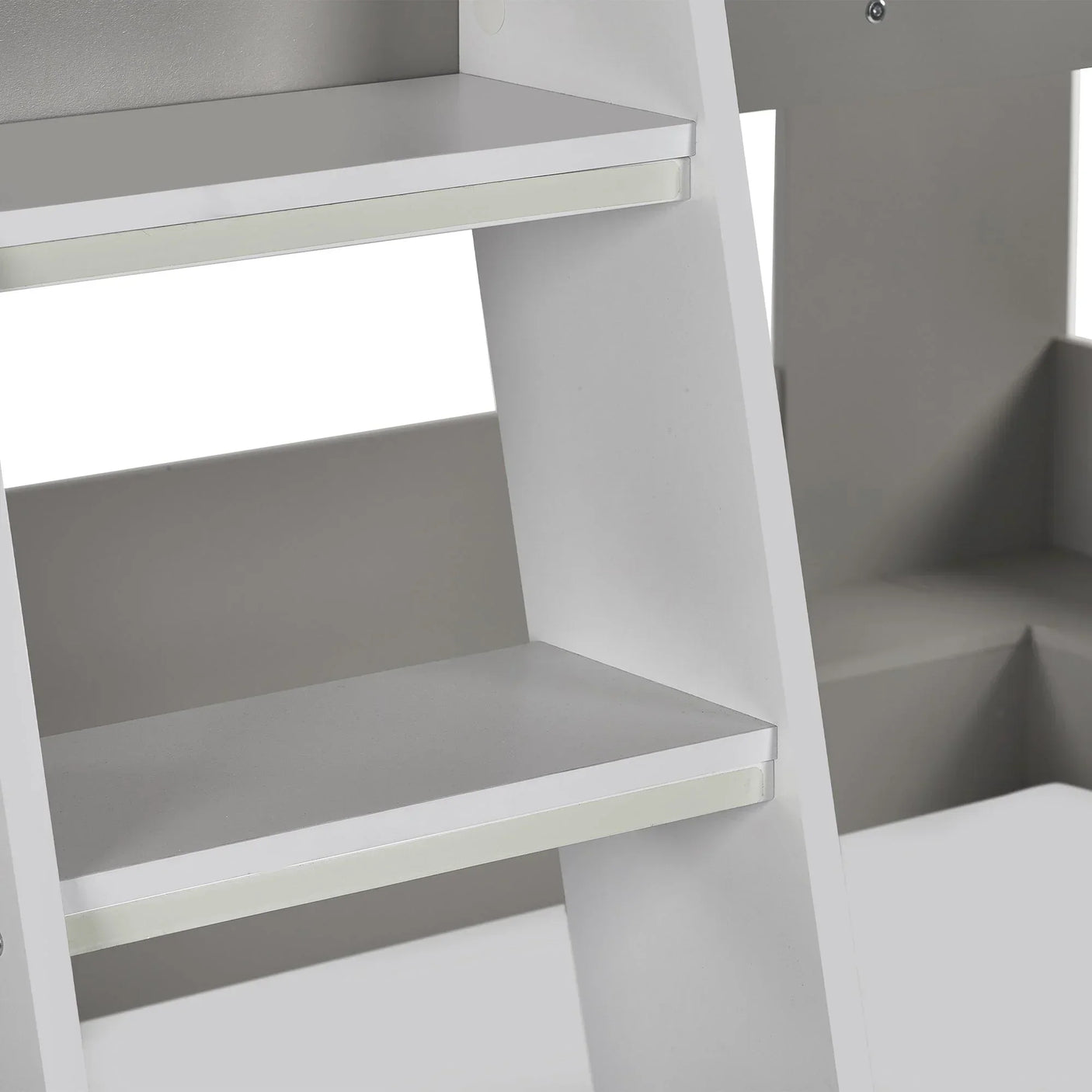 Close-up of taupe and white bunk bed ladder steps and side panels