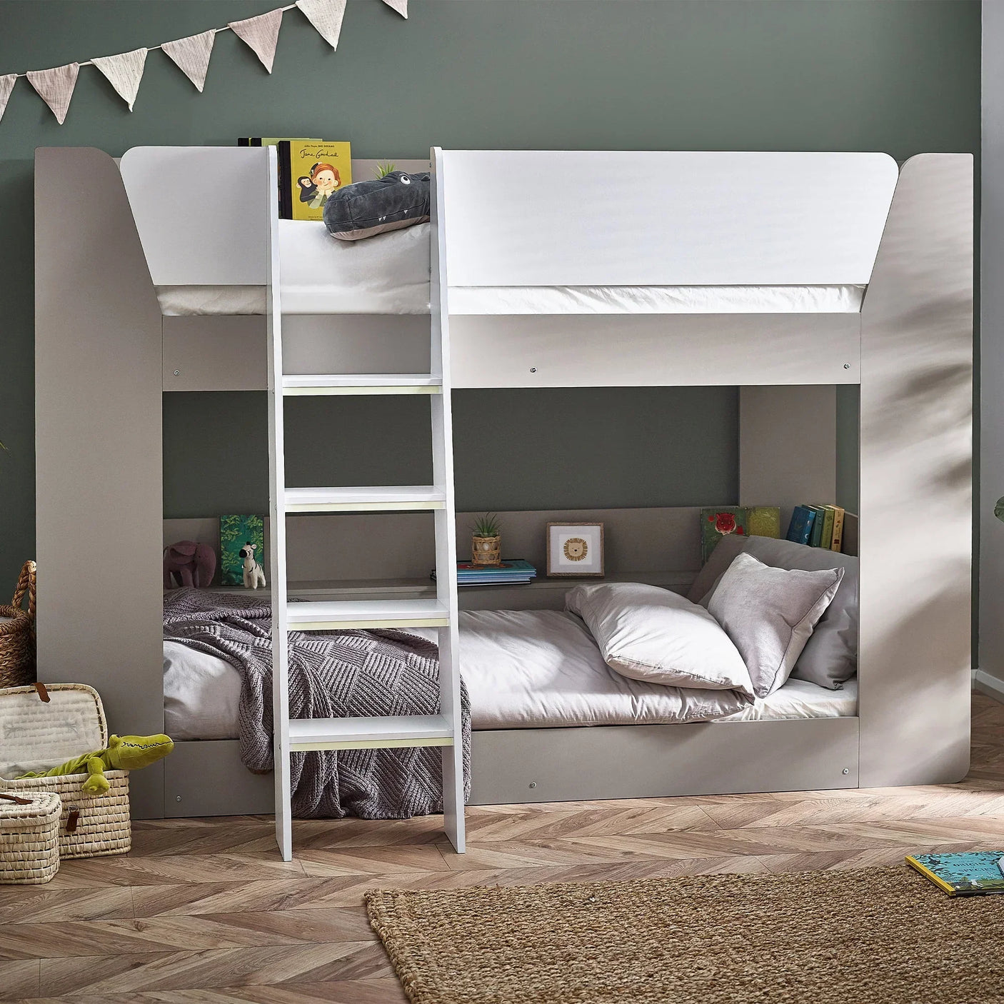 Taupe bunk bed with white ladder in children’s bedroom, books on lower and upper beds