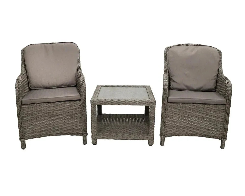 Rattan garden furniture set with two armchairs and glass-top coffee table