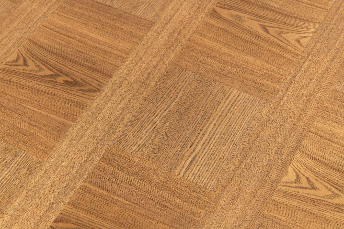 Closeup of parquet wood table surface with natural grain pattern and warm oak finish