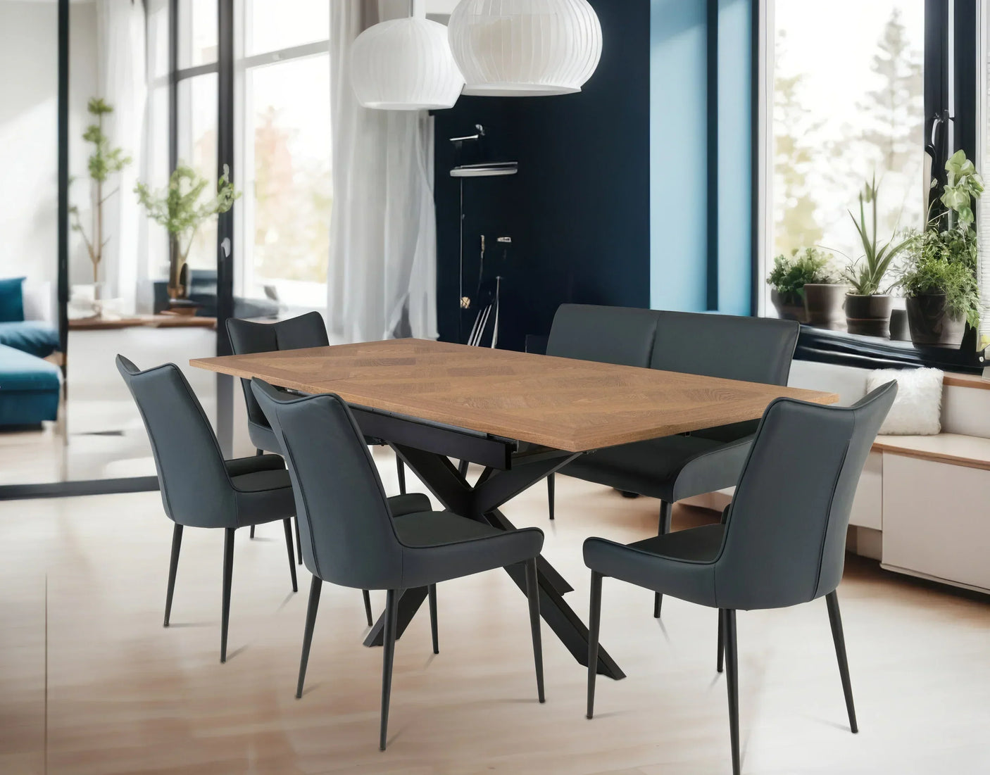 Modern dining table with wood top, six black chairs and bench in a bright dining room