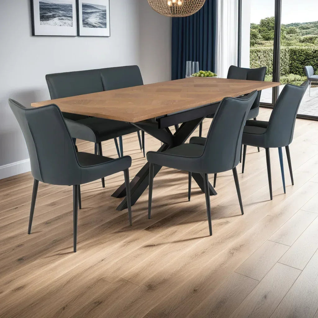 Wood dining table with black upholstered chairs and bench in modern dining room