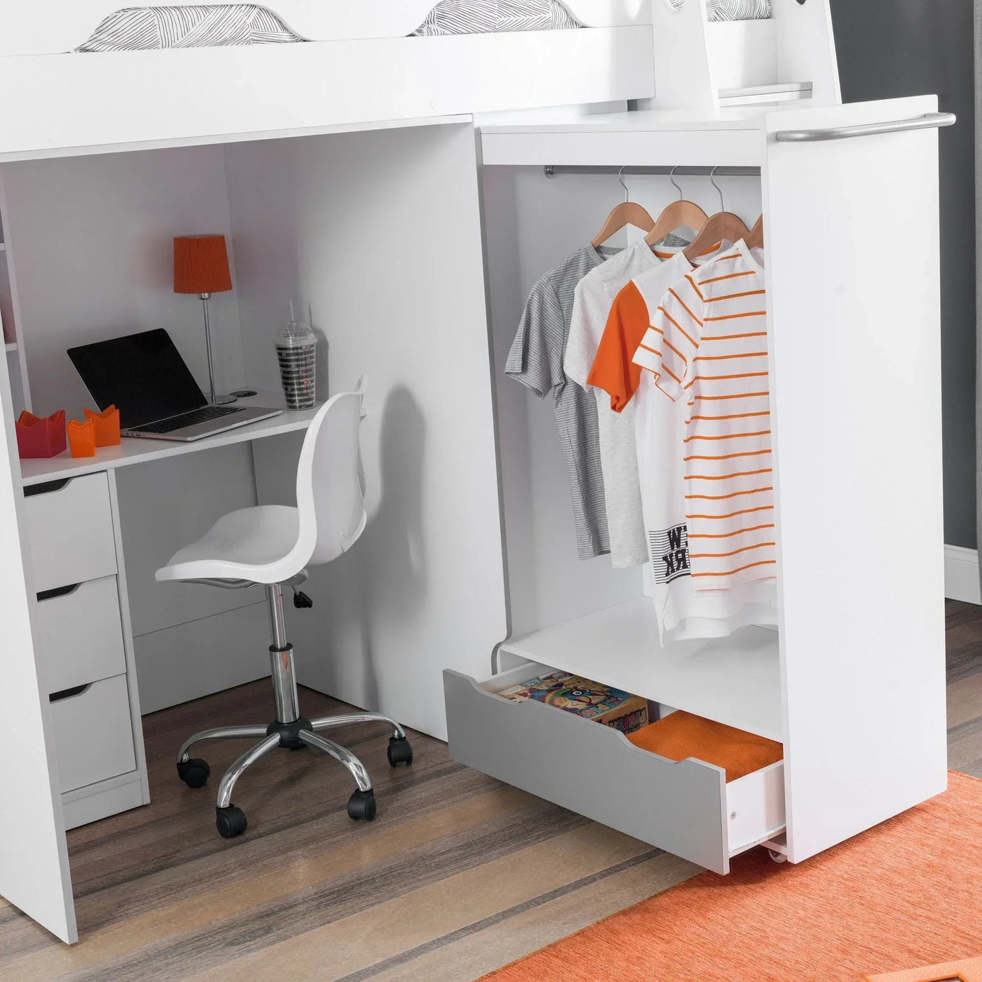 White kids storage loft bed with built-in desk, wardrobe space, and open drawer on wood floor