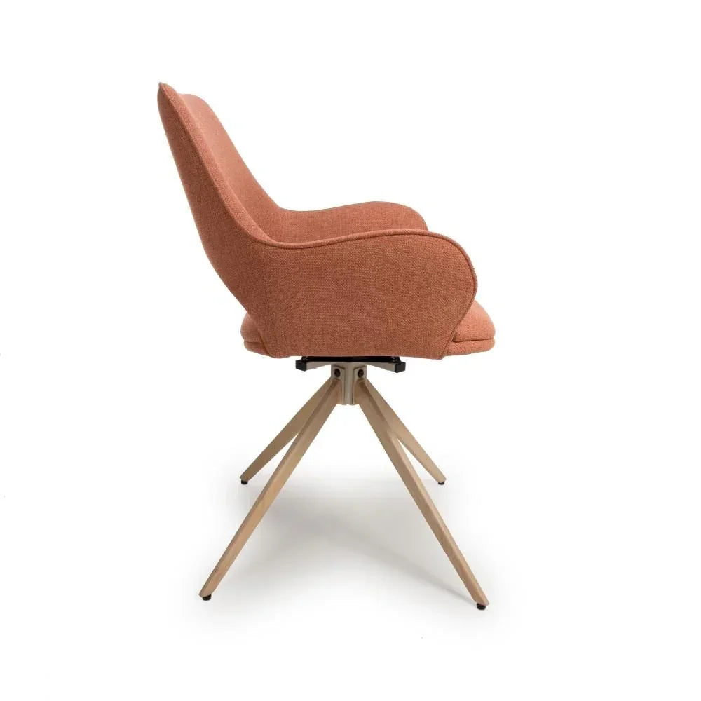Side view of orange upholstered chair with wooden legs and swivel base