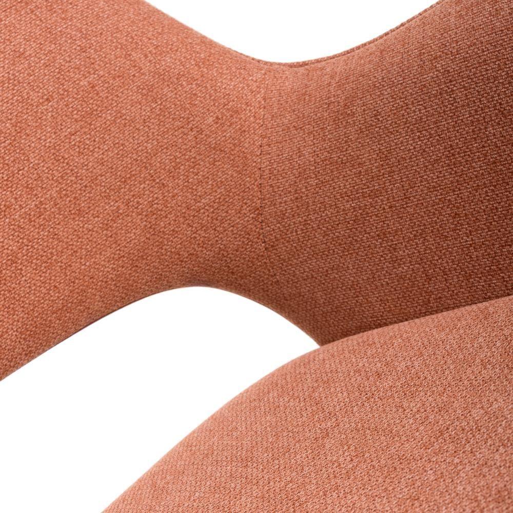 Close-up of textured orange fabric dining chair backrest and seat curve
