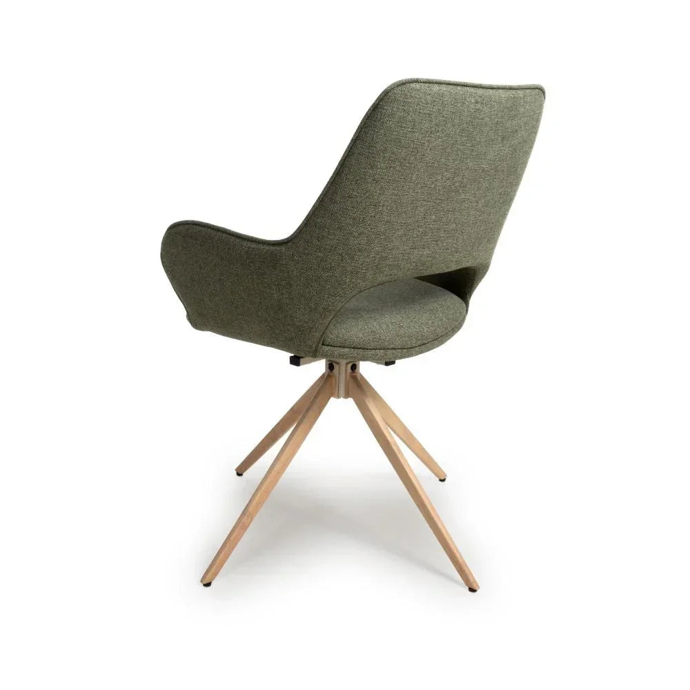 Green fabric dining chair with curved backrest and light wood legs, rear view