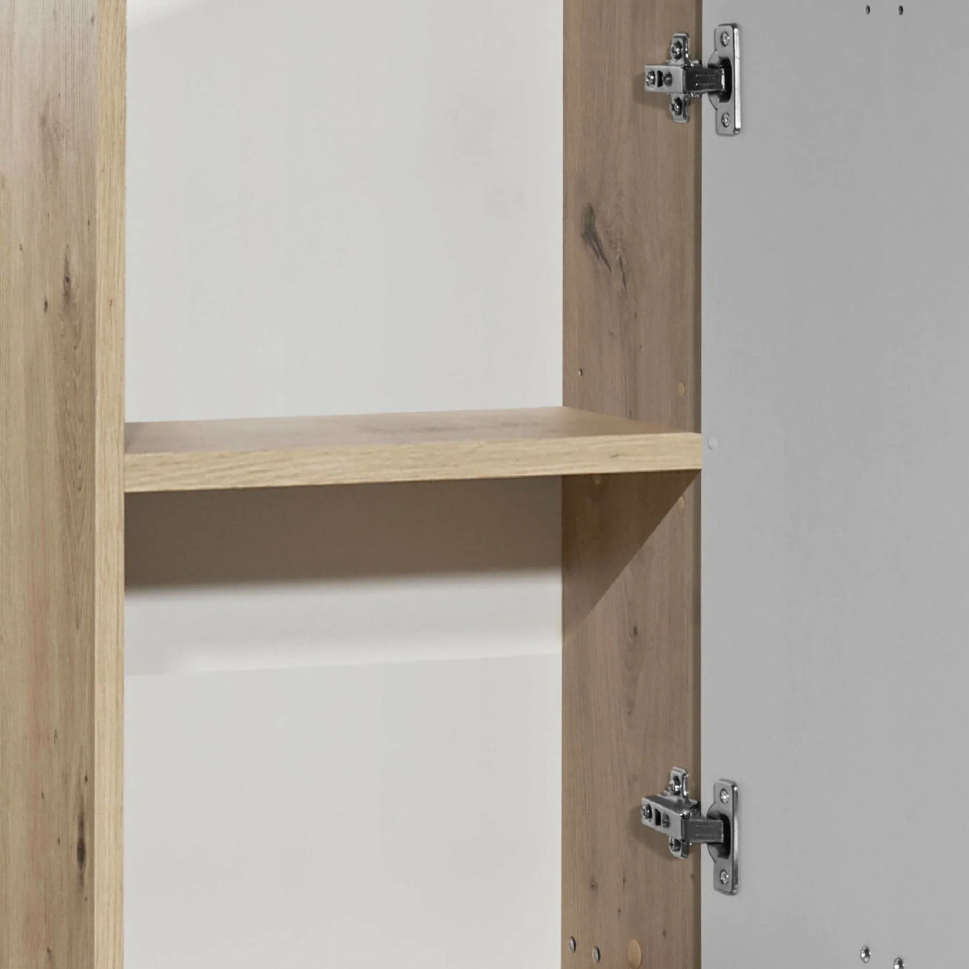 Oak effect wardrobe interior shelf and door hinge detail