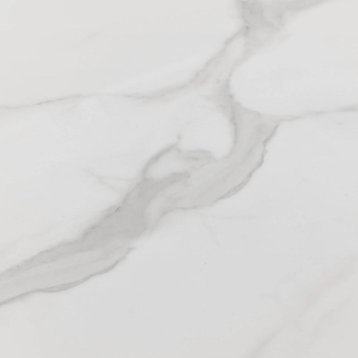 White marble tabletop with subtle grey veining, close-up view showing smooth finish