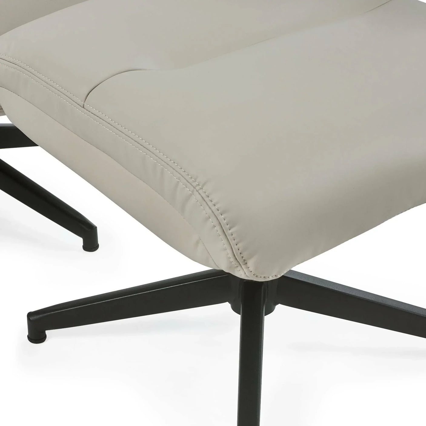 Grey chair and stool with stitched detail and black metal base, close-up view