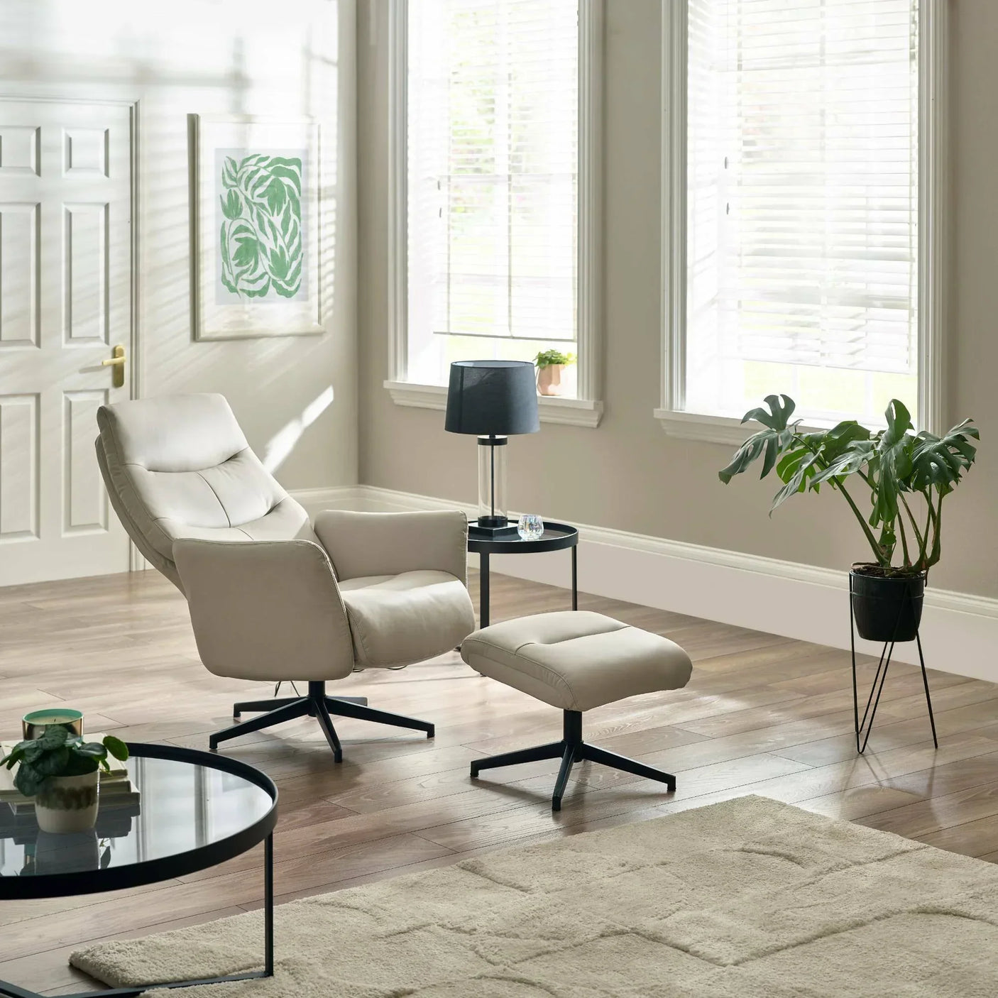 Grey Priya chair and stool set in a bright living room with wooden floor and modern decor
