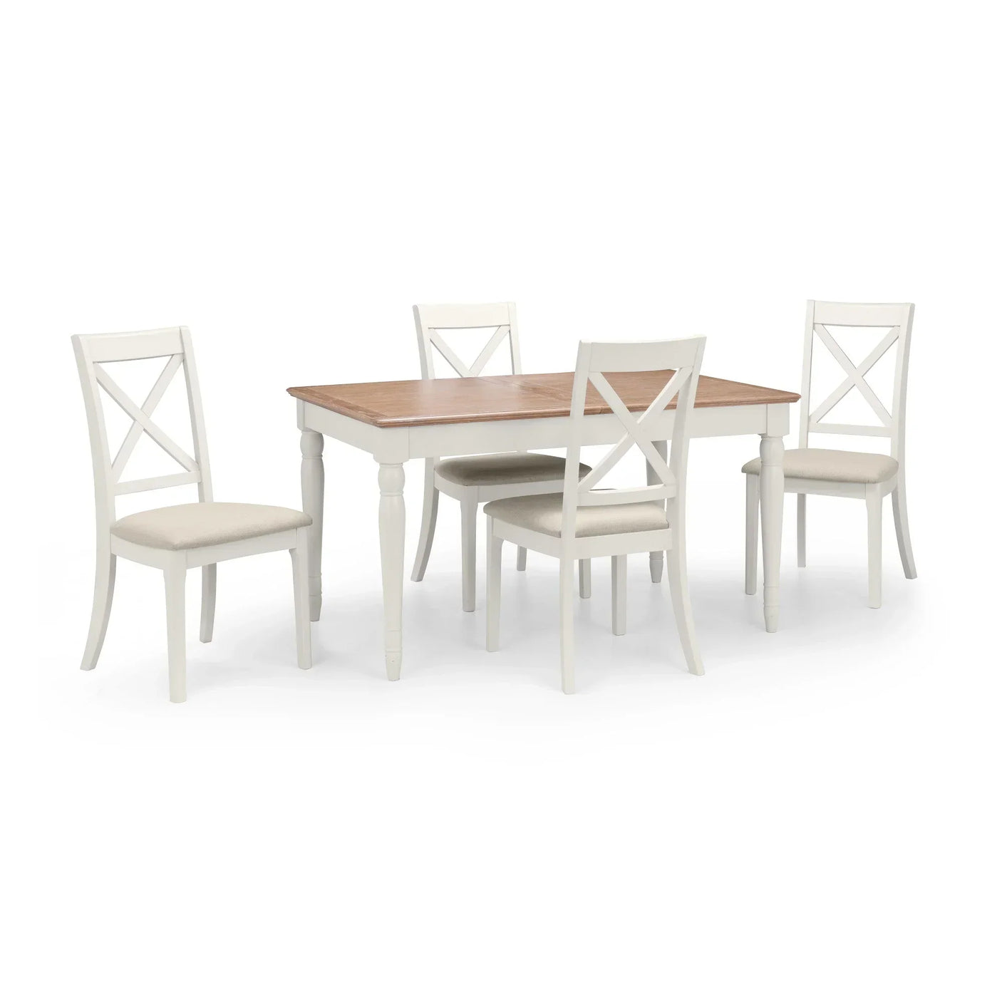 Wood dining table with four white cross-back chairs and cream seat cushions